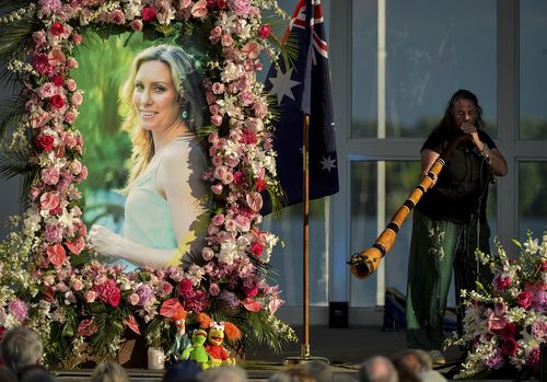  Johanna Morrow plays the didgeridoo during a memorial service for Justine Ruszczyk Damond at Lake Harriet in Minneapolis