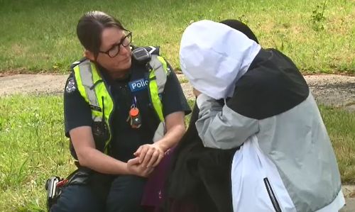 Police comfort the mum of a young woman found dead inside a Melbourne home.