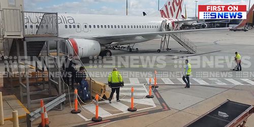 Andrew Gaff on the tarmac at Melbourne Airport earlier today. Picture: 9NEWS