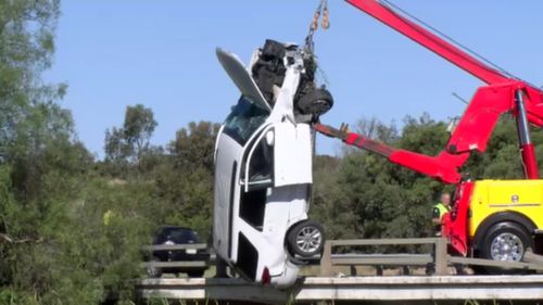 A crane was used to pull the car from the creek.