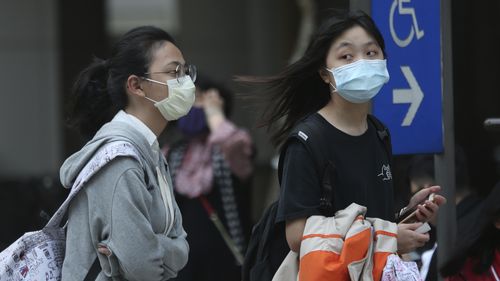 People wear face masks to protect against the spread of the coronavirus in Taipei, Taiwan.