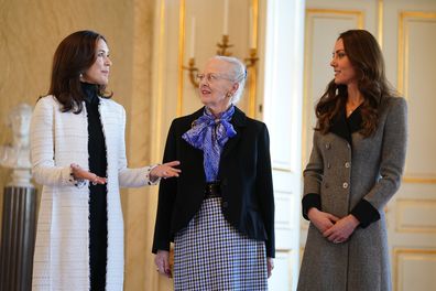 Kate Middleton, Duchess of Cambridge (right) is welcomed by Queen Margrethe (centre) and Crown Princess Mary of Denmark (left) during an audience at Christian IX's Palace on February 23, 2022 in Copenhagen, Denmark 