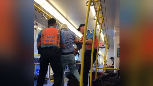 The guards dragged the main off the train. Picture: 9NEWS
