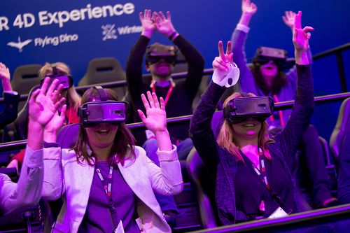 People try a VR gear during the Mobile World Congress. (AAP)