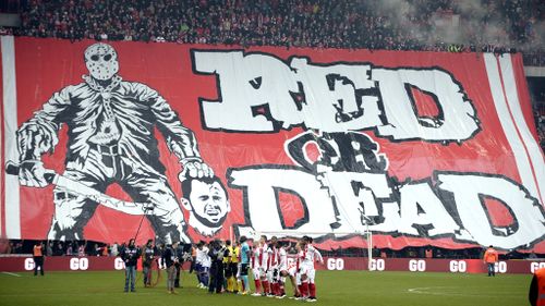 Standard Liege fans unfurl enormous banner showing former captain being beheaded