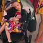 Stars trolled for letting daughter sit in stroller on holiday
