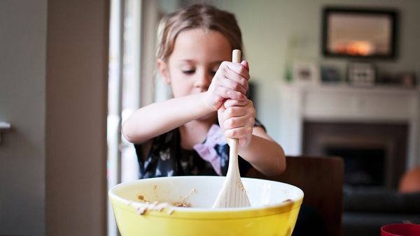 Mini chef: cooking a simple meal is an essential life skill for children before they hit high school. Image: Getty