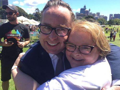 Prominent Yes campaigners Alan Joyce and Magda Szubanski embrace after the result was handed down (9NEWS/Mark Burrows)
