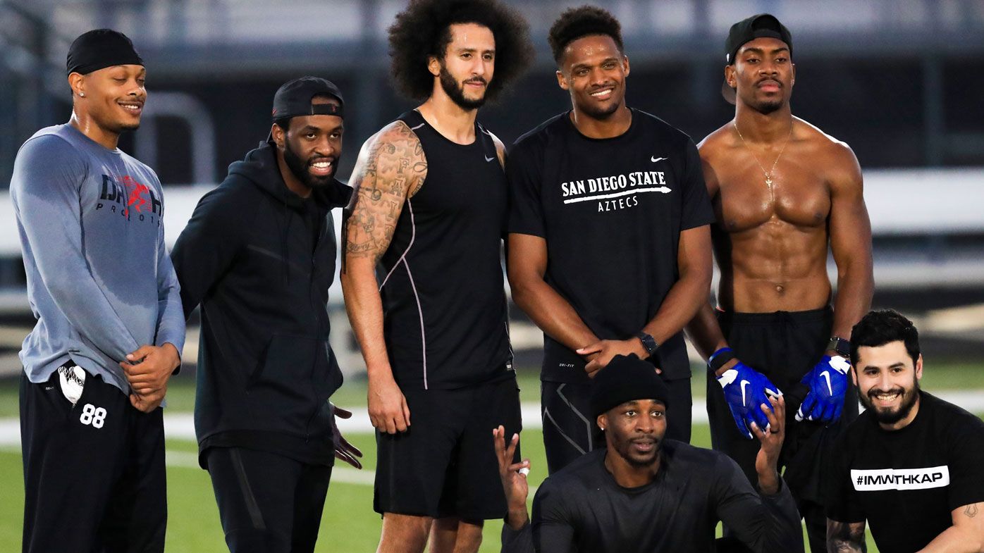Colin Kaepernick stands with Bruce Ellington, Brice Butler, Jordan Veasy, and Ari Werts during the NFL workout 