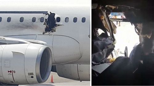 The metre-wide hole in the Daallo Airlines plane. (AFP)